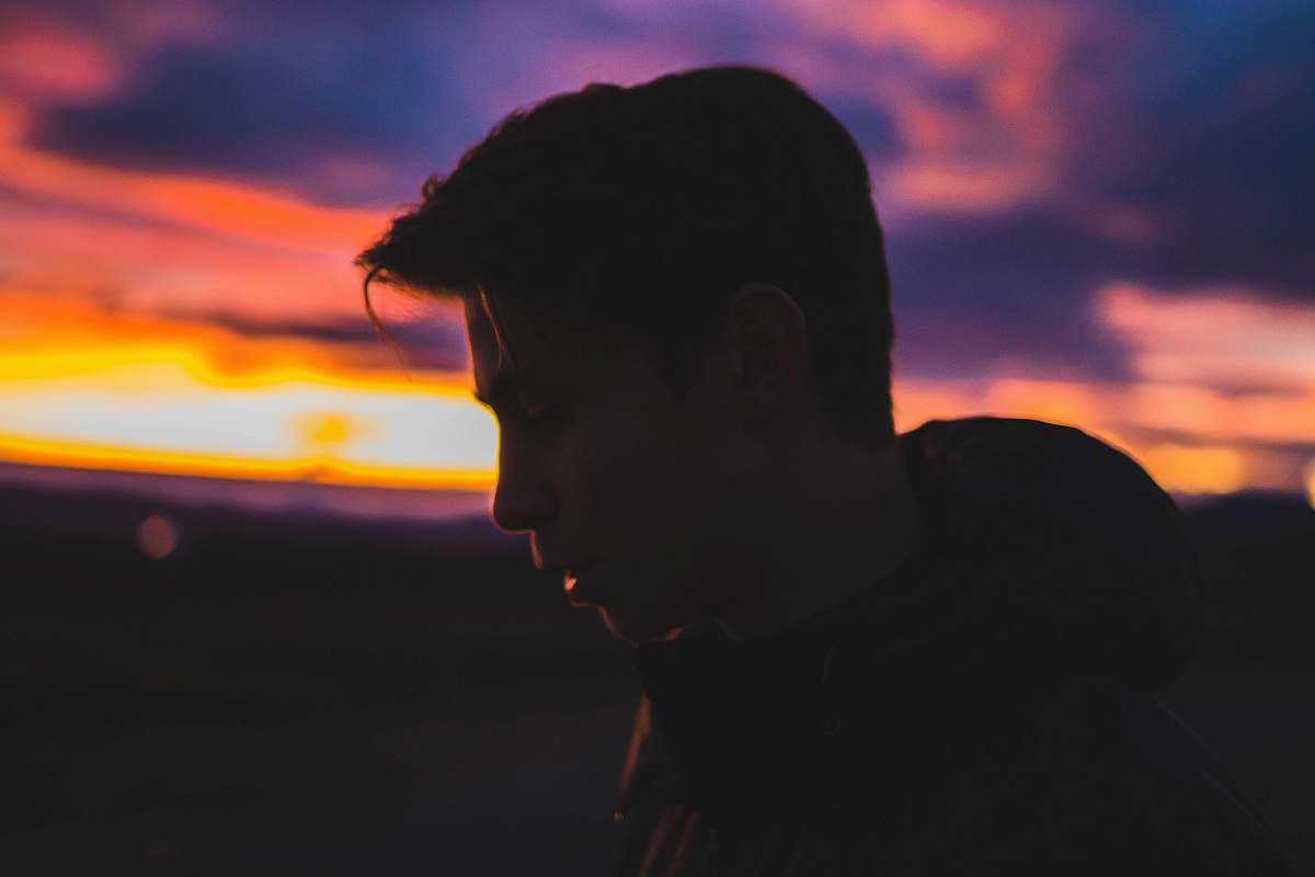 united states silhouette of man during sun set questioning